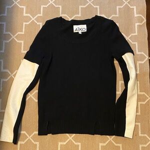 Aiko Black Sweater with White Leather Sleeves